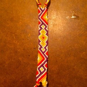 Handmade orange and purple string buckle bracelet